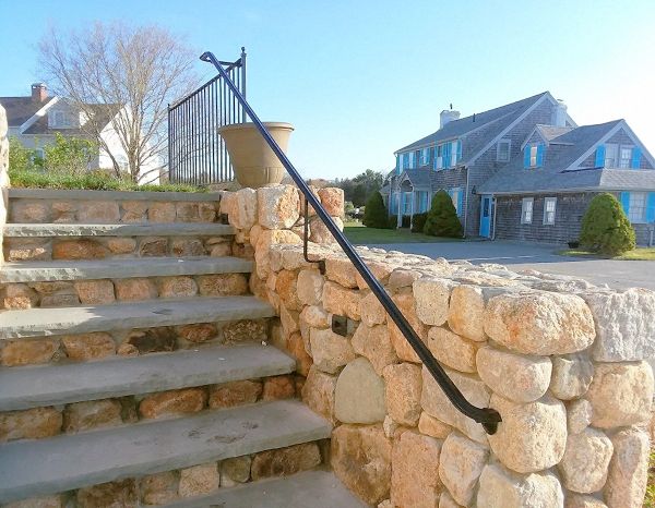 view 3 of railing installation on stone wall